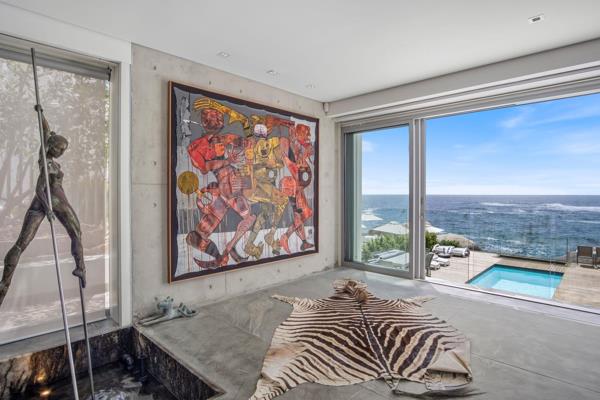 Located in a prime position, with uninterrupted Atlantic Ocean views, this luxurious ground-floor duplex apartment offers an ...