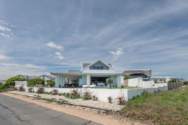 An idyllic beach villa with wrap round verandah radiates the relaxed ambiance of a holiday home with emphasis on indoor outdoor living ...