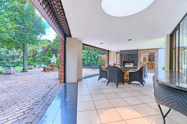 Set behind an impressionable, tree-lined entrance, this exceptional home exudes luxury ...