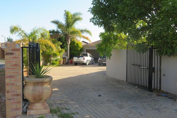 The unique pan-handle property located in Eikenbosch Estate, Kuils River, is accessed through a double swing gate. Upon entering through the front door, you are greeted by an open-plan family room, dining area, and kitchen, which connects to the braai room through stacking ...