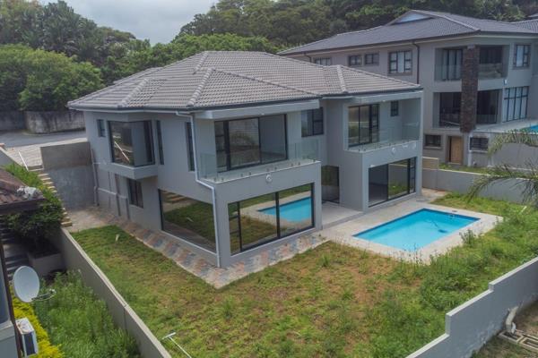 Nestled in the serene and secure The Farm Eco Estate in Shelly Beach, this stunning 4-bedroom home offers the perfect blend of luxury ...