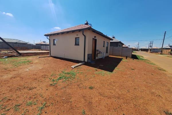 Main bedroom with en-suite bathroom, curtain rails, built-in cupboards, king bed and ...