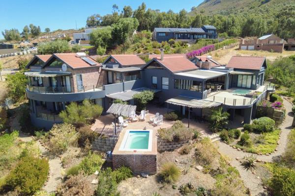 This exceptional property, situated near the majestic Riebeek Mountain, is now available for sale.
As you pass through the secure gate ...