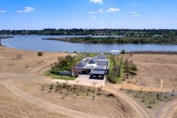 NOTABLE FEATURES
- Single level &amp; Generous Spaces
- Solar System
- 24 Hour Security
- North Facing

This riverfront home exudes ...