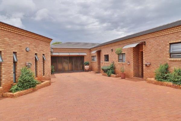 The heart of the home is built around the impressive hexagonal double-volume open-plan reception area, featuring a ...