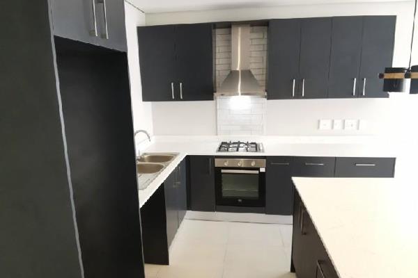 Currently occupied by a tenant.

Discover the perfect home for your family in this modern three-bedroom property. 

Modern Kitchen: ...