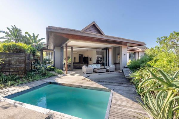 Modern level home situated in Zimbali Coastal Estate. This level home features high ceilings, an open plan living space, dining area ...