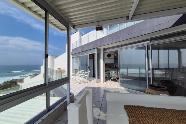 Discover the epitome of coastal living in this stunning beachfront apartment, where ...