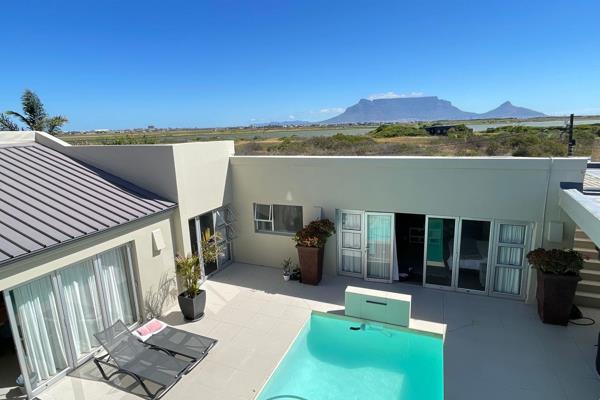 Discover this exquisite 4-bedroom, 4-bathroom residence nestled in the prestigious Golden Mile of Flamingo Vlei, Cape Town. Adjacent to ...