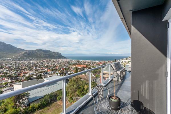 This contemporary designed three level home set against a mountain backdrop offers ...