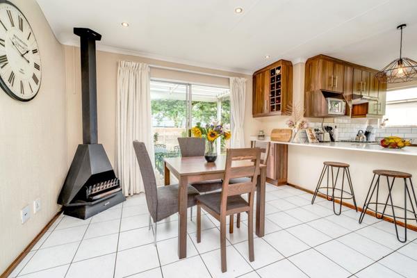 This is a modern three-bedroom, two-bathroom home featuring an open-plan kitchen and lounge area that seamlessly flows onto a covered ...