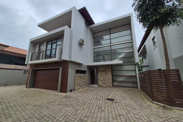 This modern family home is perfectly situated within a secure complex in upmarket Izinga, offering peace of mind and an opulent ...