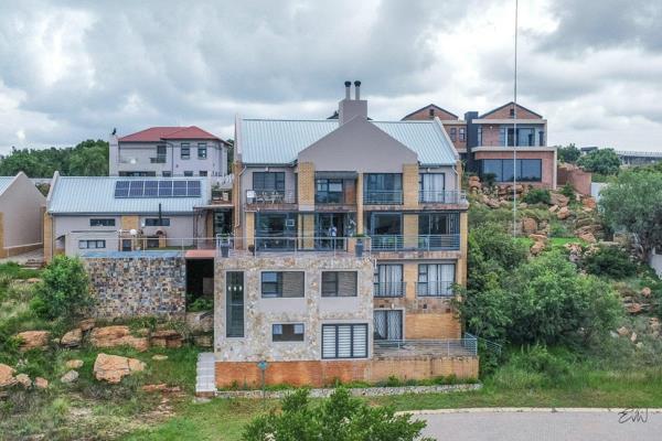 Situated in the prestigious Aquavista Mountain Estate, this stunning townhouse offers breathtaking views of Bronkhorstspruit Dam and ...