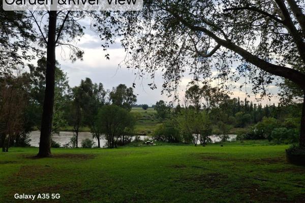 Breathtaking 800 meter river frontage, with tranquil views, five spacious residences, including 3rd residence need some tlc, main ...