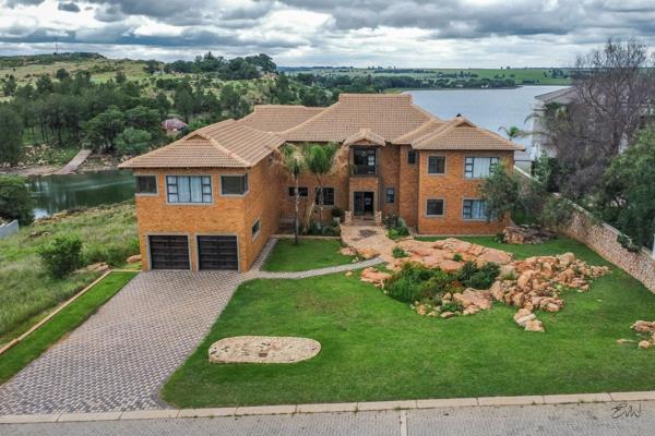 Location is everything and this house has one of the best Locations on the Ridge in AquaVista close to the dam wall. The house features ...