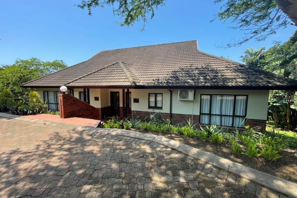 A single level, semi-detached apartment constructed of plastered and painted brickwork under concrete tiled ...