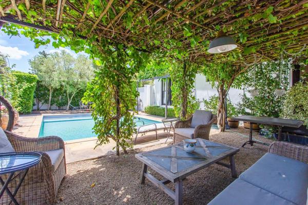 SOLE MANDATE :  The most romantic pied- a&#180;- terre in the village of Franschhoek is now for sale.

The freehold house is centrally located, yet tucked away in a lush and secluded garden.
A conservatory wraps around two sides of the house, creating a study with a fireplace ...