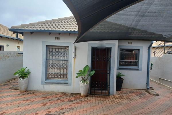 Cozy magnificent 3 bedroom house lounge brown build in kitchen carport wall and gate in clayville  the heart of ikurhuleni