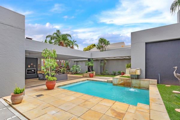 Indulge your heart&#39;s delight in this lovely family home which encircles the tranquil garden, a covered patio with a built-in braai ...