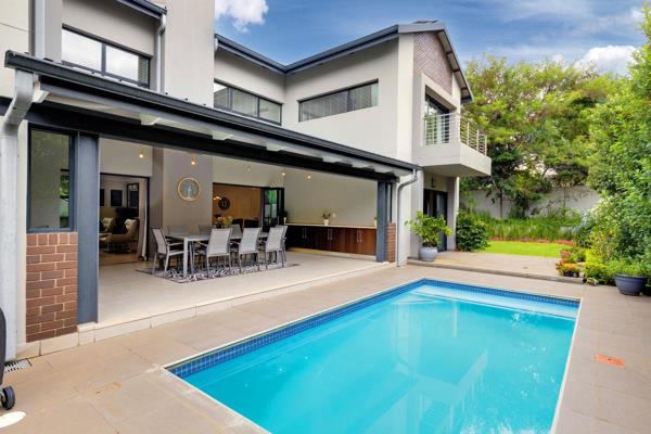 Nestled within the prestigious Helderfontein Estate, this contemporary residence epitomizes luxury living. Designed with a ...