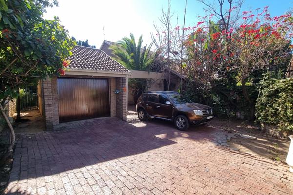 Townhouse with large garden and lock up garage in Sandton offering comfort and ...