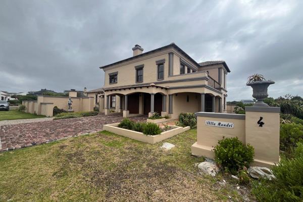 This incredible Tuscan-style home, situated just 20 meters from the seafront, offers ...