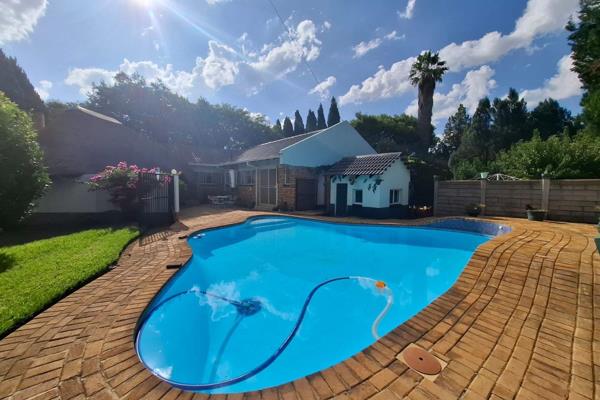 Discover this breathtaking three bedroom home, nestled in a tranquil tree-filled garden with a sparkling blue swimming pool and cozy ...