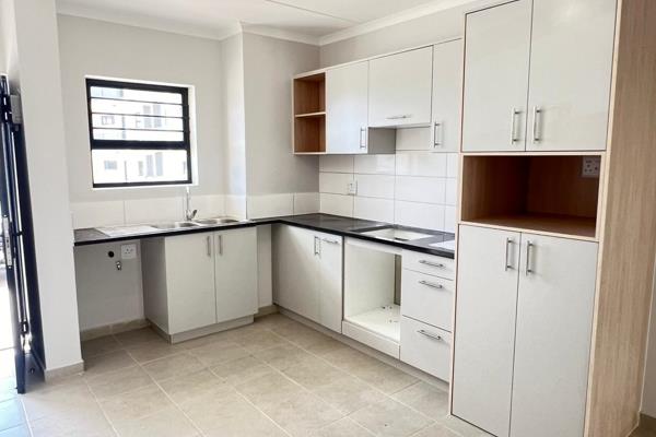 A sleek, modern 2-bedroom ground-floor apartment in the secure Langeberg Village complex. The open-plan kitchen, featuring a gas hob ...