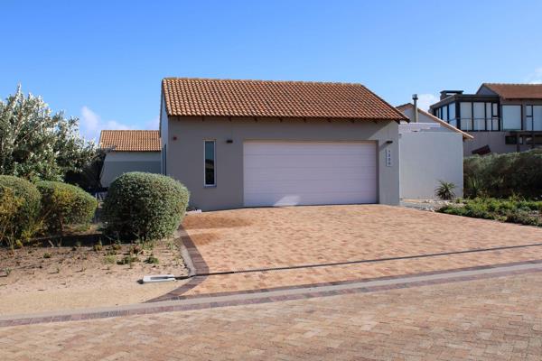 Welcome to this charming 3-bedroom home located in the highly sought-after Langebaan Golf Estate, where style, comfort, and nature ...