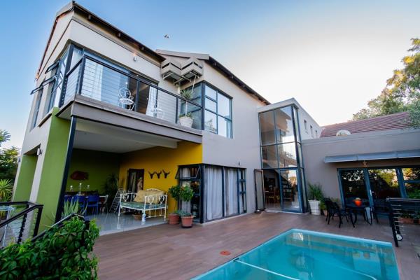 This modern, light-filled home, designed with walls of windows, creates a captivating sensation of floating amidst natural light that ...