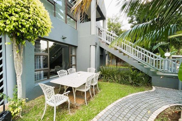 Nestled in a sought-after complex close to the Gautrain and Sandton City, this stunning ...