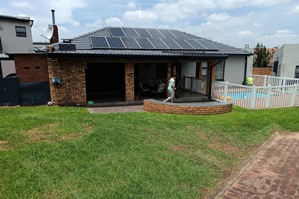 This gorgeous family home has so much more to offer than meets the eye!

Large entrance patio with built-in braai, leading to dining ...