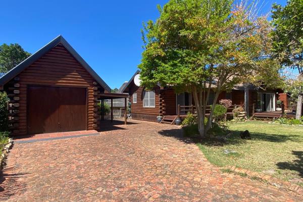 Nestled in a serene, tree-filled cul-de-sac in the heart of Wilderness, this delightful log cabin-style home offers a tranquil retreat ...