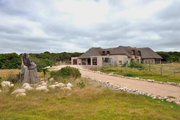 Beautiful thatched roof home with distant ocean views situated on a 3-hectare stand ...