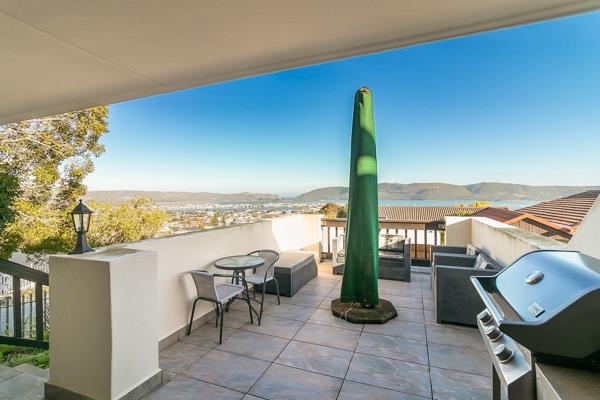 Stunning views of the Knysna Lagoon and through the Heads to the Indian Ocean from this totally rebuilt family unit in a secure gated ...