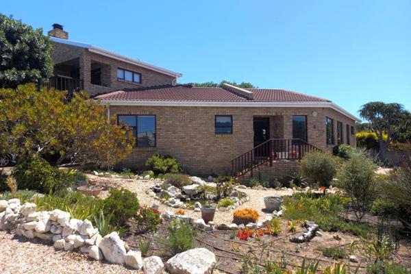 Nestled in the tranquil surroundings of Stilbaai West, this expansive facebrick home ...