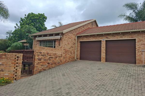 Lovely face brick unit with a tiled roof in this sought after area with spacious, private garden, enclosed lapa with braai and wooden ...