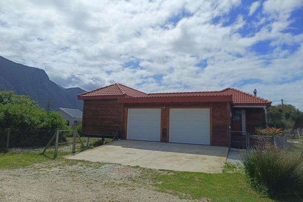 Lovely wooden house for sale, situated on a corner stand and close to the ...