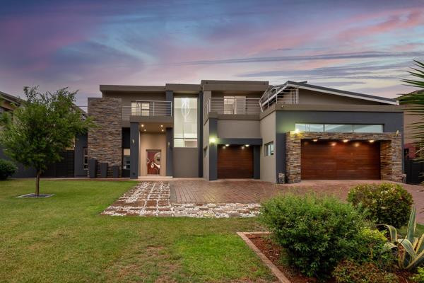 This stunning ultra-modern 5-bedroom, 3.5-bathroom home redefines open-plan living with a sophisticated, seamless design perfect for entertaining and family life. The home features multiple spacious living areas, each with sleek ...