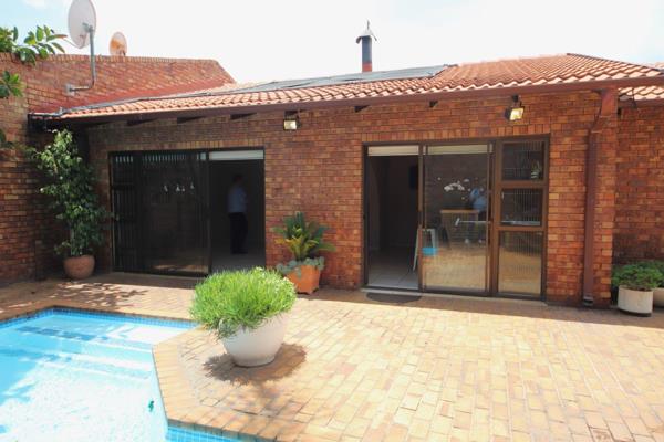 Entrance hall, lounge, dining room, and Family/TV room with a fireplace leading to the garden
Entertainment room with a built-in bar ...