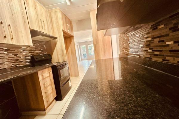 The kitchen includes ample built in cupboards space, an oven, stove, extractor fan ...