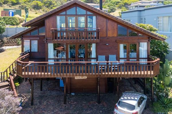 Wake up to breathtaking ocean views from this beautifully maintained log home in ...