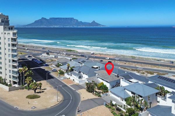 Located on the prestigious Golden Mile in Blouberg, this stunning beachfront ...