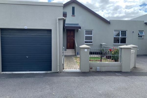 This modern single-storey duet townhouse for sale in Brackenfell South offers a blend of ...