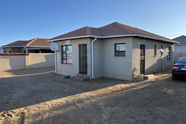 This neat house is tiled throughout, and has an L-shaped open plan configuration of ...