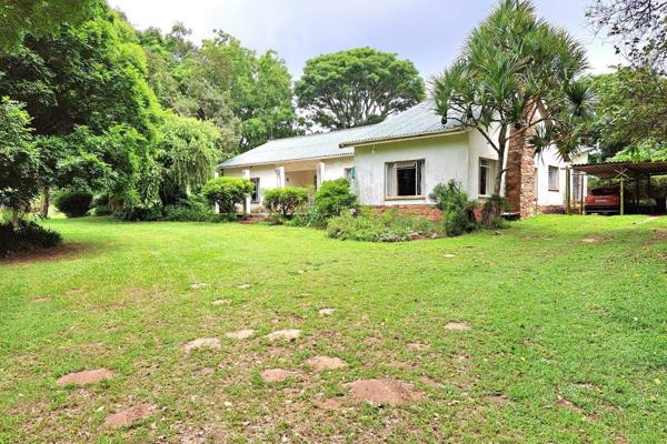 This charming older style home offers the perfect blend of country living, character and ...