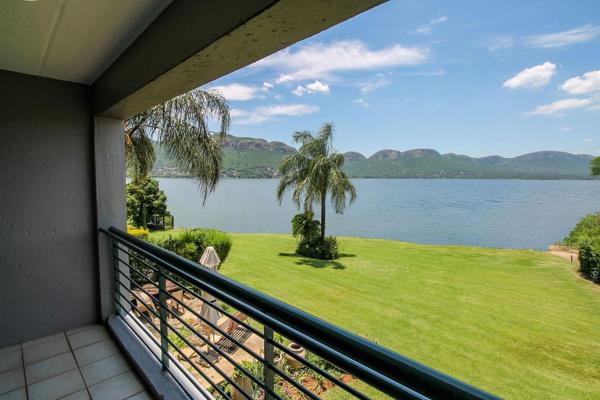 Located in the perfect position on the edge of the Hartbeespoort Dam, this north-facing two-bedroom, two-bathroom duplex unit boasts ...