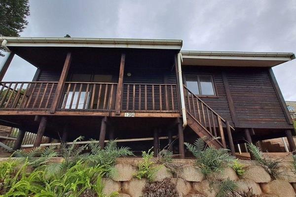 This charming, fully furnished two-bedroom cabin is located on a shared property. It features an open-plan kitchen and living area ...