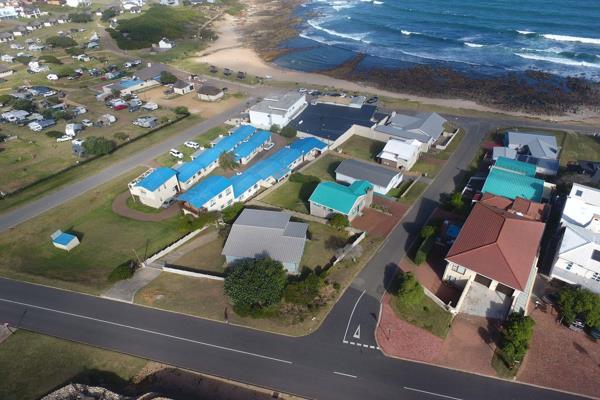 DUAL MANDATE: Wake up with views and the smells of the sea, from your bedroom, living areas and deck.

Around the corner of the tidal ...