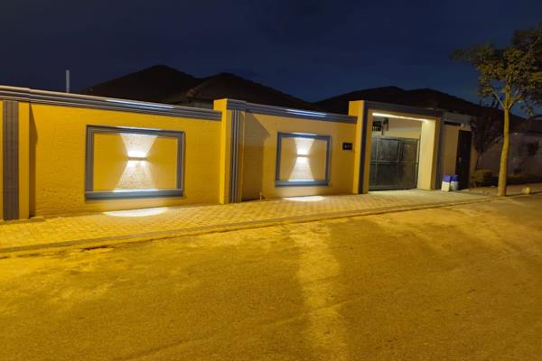 This property boasts with an amazing perimeter wall with lovely lights.

Large modern ...